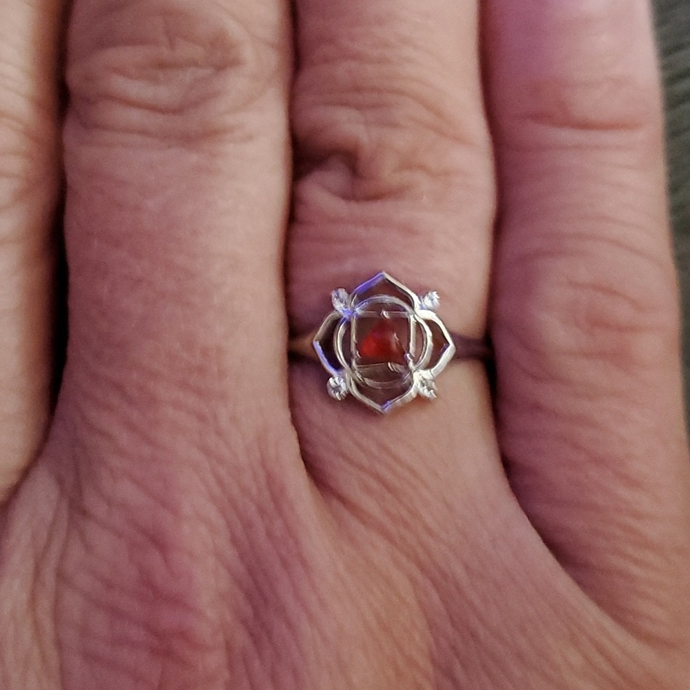 STERLING SILVER WITH REDDISH ORANGY STONE